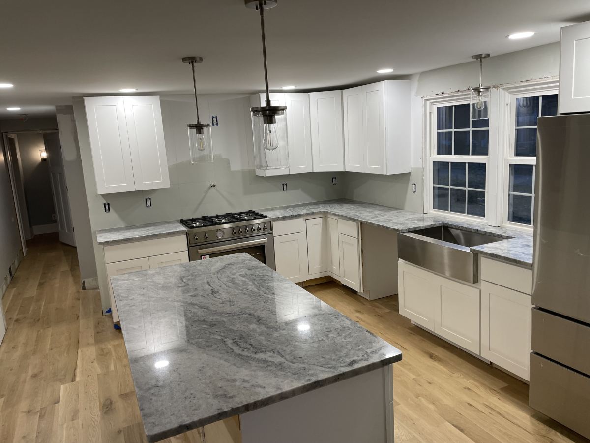 Kitchen island with gray veined granite